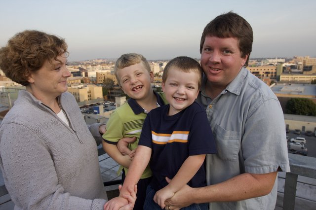 Family Portrait on Urban Rooftop at Dusk