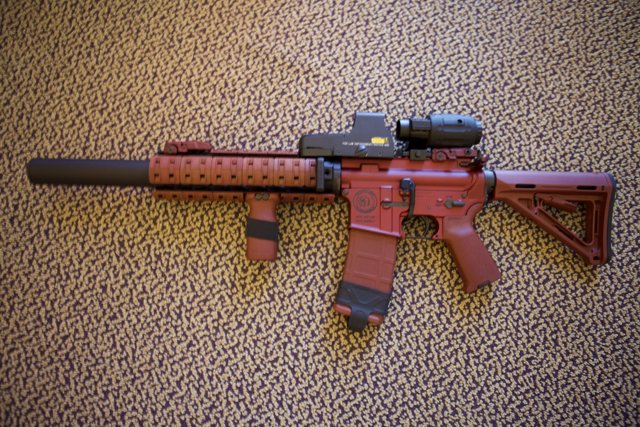 A Red Rifle with Precision Scope