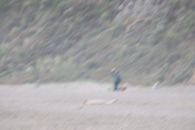 Solitary Camper on Remote Rocky Beach Shore