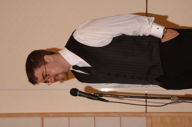 Groomsman Speaks at Wedding Reception Microphone