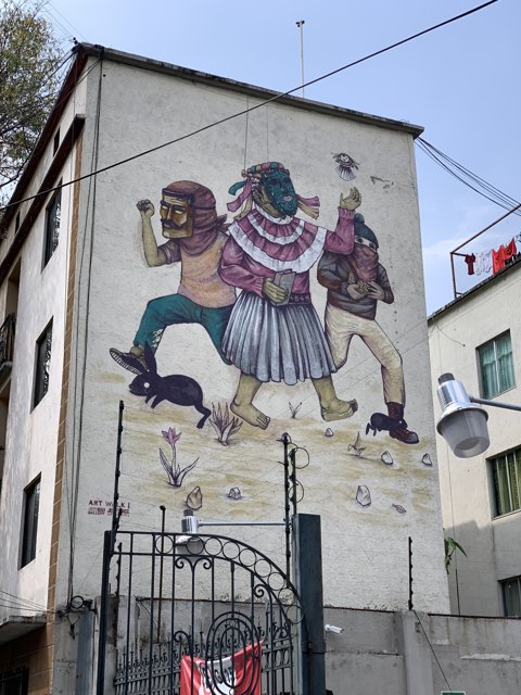 Three People Mural on Building