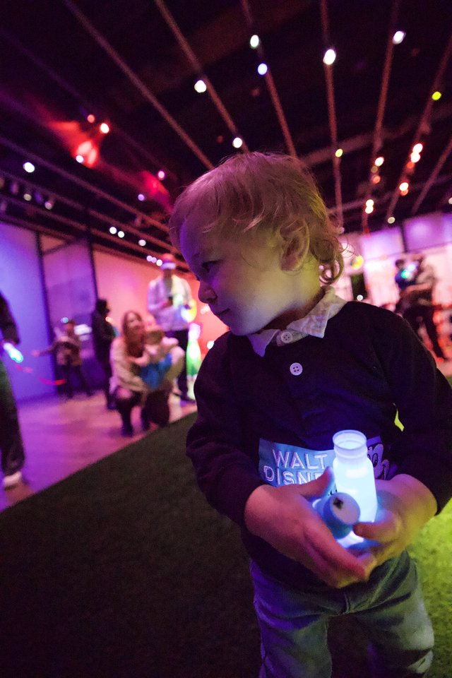 Toddler Enjoying Baby Rave Light Show Experience