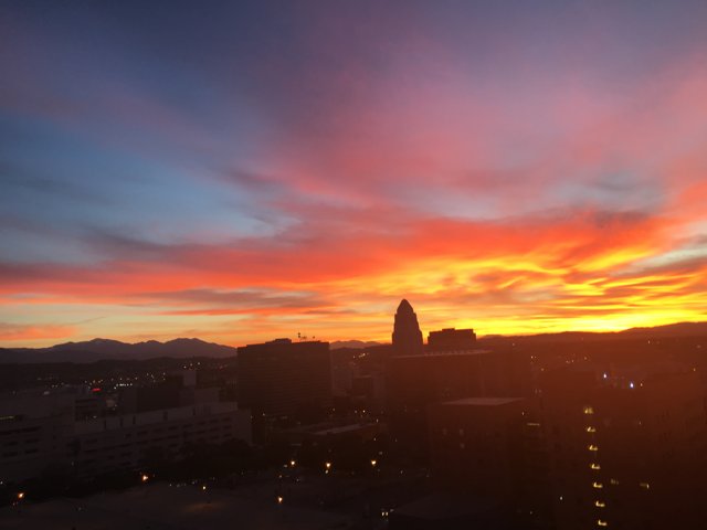 Silhouette of Salt Lake City's Urban Skyline Against a Glowing Sunset