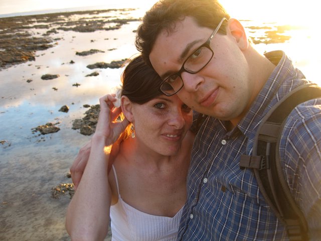 Couple Embracing at Golden Hour Beach Sunset