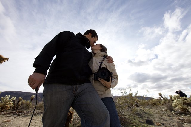 Romantic Desert Kiss Under Dramatic Skies