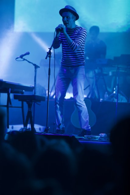 Stuart Murdoch Rocks the Stage in His Striped Shirt and Fedora