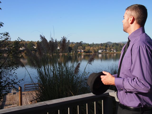 The Purple Shirted Gentleman by the Water