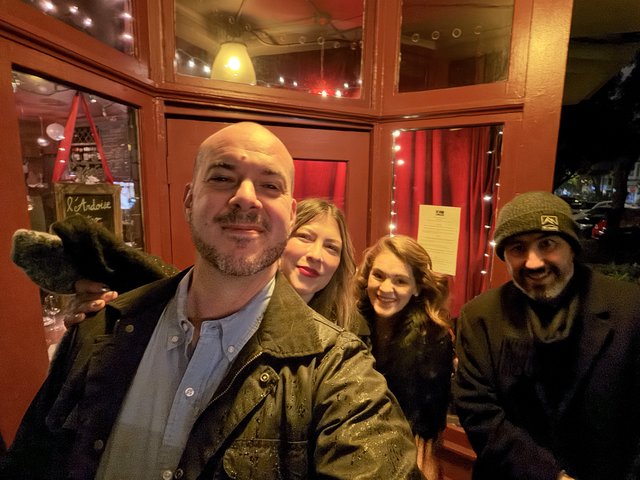 Group Selfie at Cozy Restaurant Entrance
