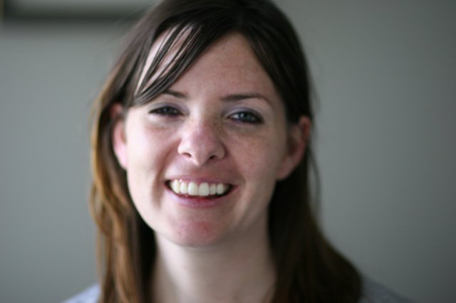 Candid Portrait of a Smiling Young Woman Indoors