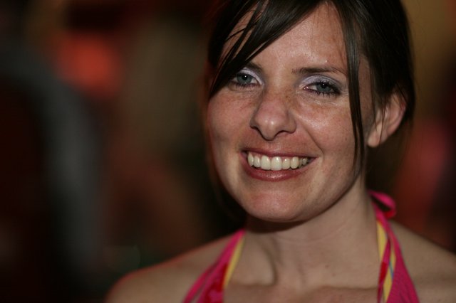 Radiant Smile at a Lively Evening Event
