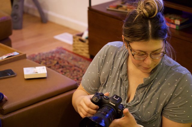 Photographer Reviewing Camera at Home Studio Session