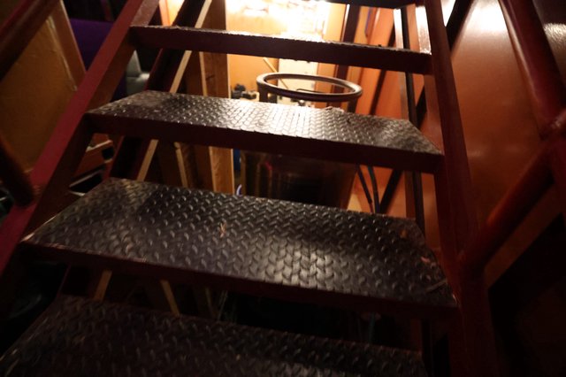 Industrial Steel Staircase Descending Into Dim Basement