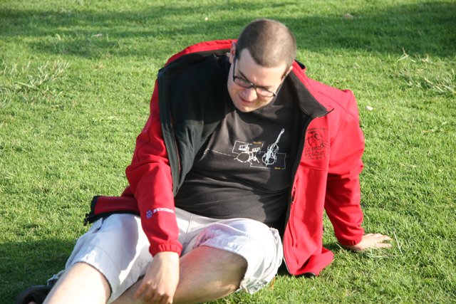 Man sitting on a grassy field