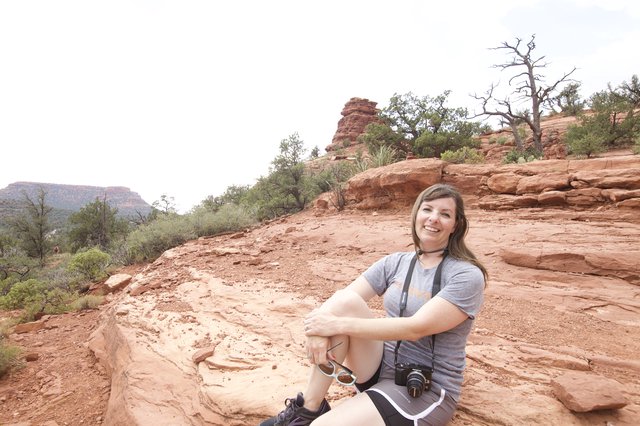 Hiker Resting on Red Rock Formations in Sedona