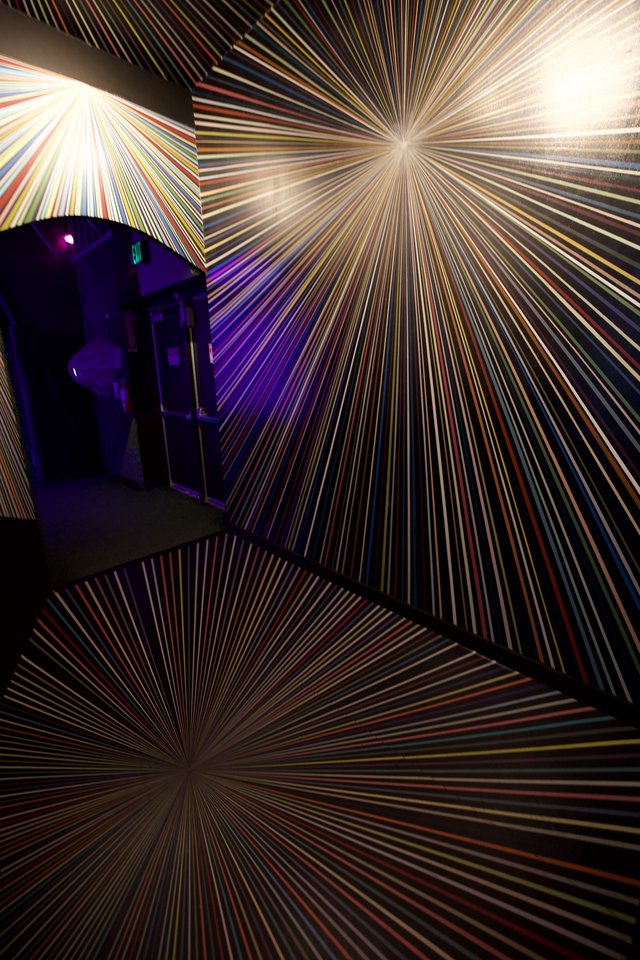 Immersive Multicolored Starburst Light Installation in Gallery