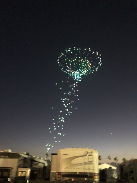 Green Balloon Soaring Above a Night Sky
