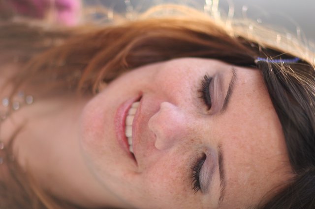 Freckled Beauty Smiling Softly in Natural Light