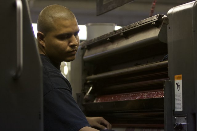 The Man Behind the Printing Machine