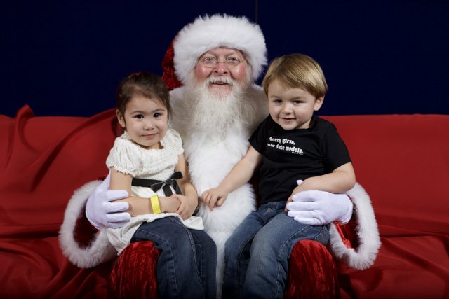 Santa Claus Spends Time with Two Adorable Kids