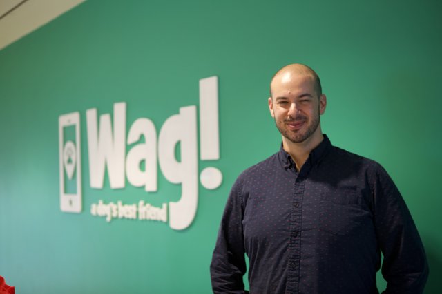 The Smiling Man in Front of the WAG Logo