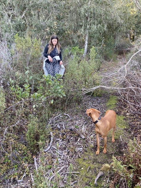 A Woman and Her Furry Companion Explore the Wilderness
