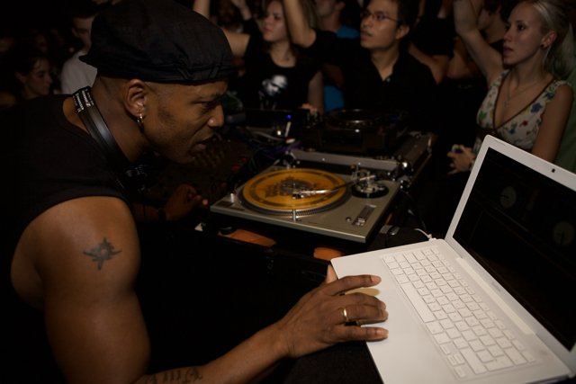 Nightclub DJ in Black Tank Top