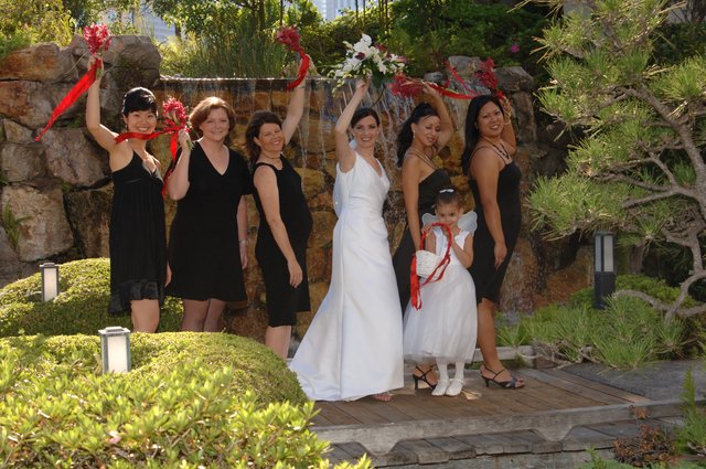 Joyful Bridal Party Celebrates at Garden Waterfall