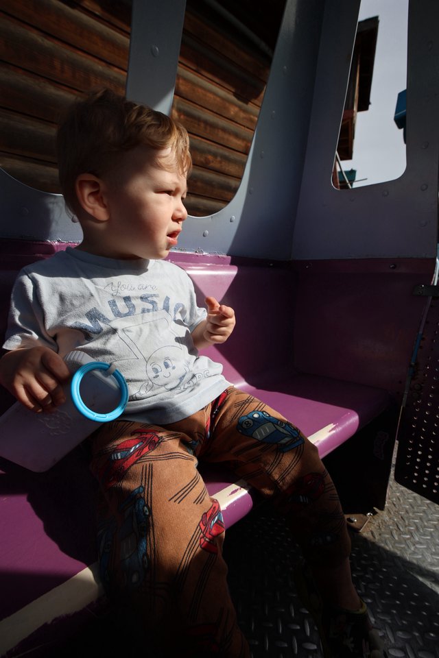 Young Child on Amusement Park Ride at Fantasyland