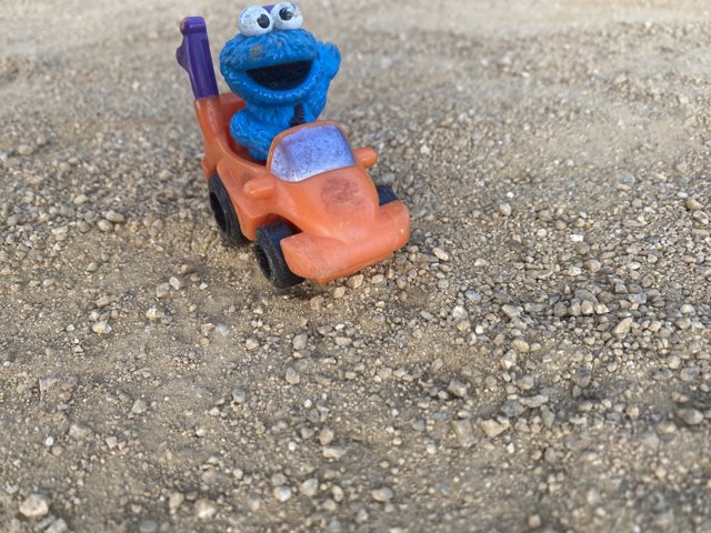 Cookie Monster Takes a Ride On a Gravel Road