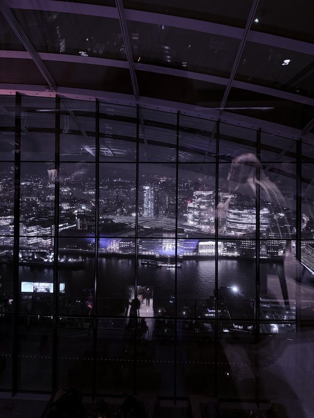 Ghostly Figure in London Skyline Observatory at Night