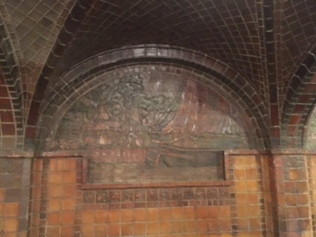Mural on a Tiled Wall in a Crypt-like Church