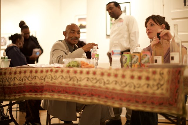 Conversation at a Community Gathering Over Dinner