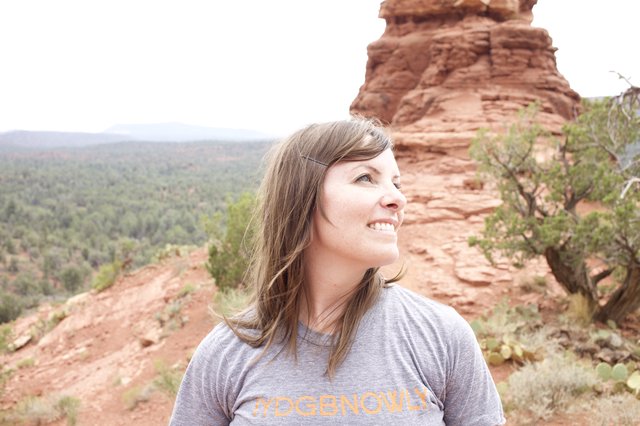 Woman Smiling Among Sedona's Red Rock Formations