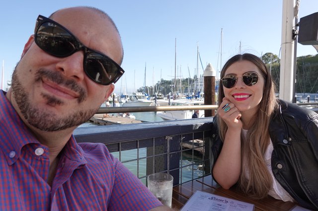 Couple Enjoying Waterfront Dining at Marina
