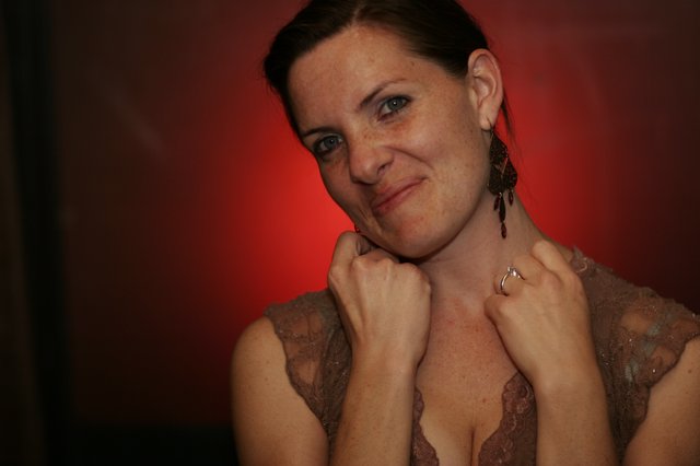 Playful Portrait of Penelope Against Red Background
