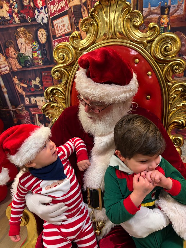 Children Meeting Santa Claus in His Ornate Throne