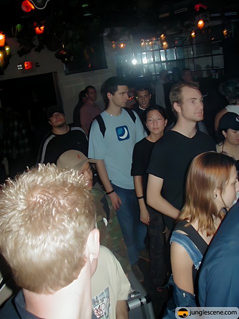 Nightclub Crowd in Hats and Jeans