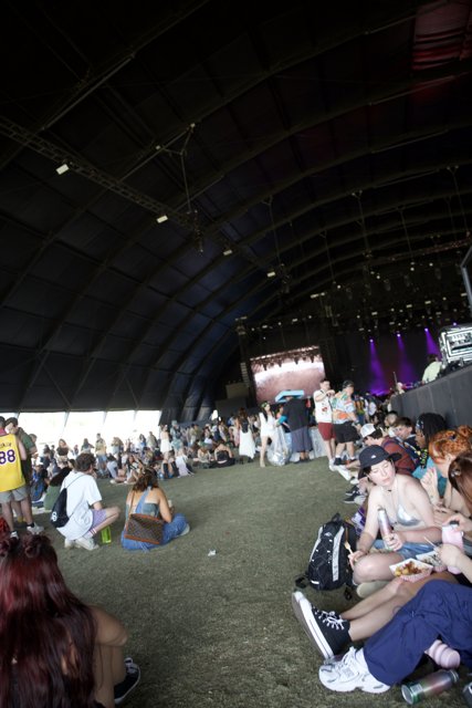 Coachella Vibes: Casual Moments Under the Stage Tent