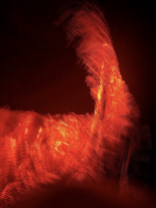 Digital Inferno: Abstract Portrait in Red Particles