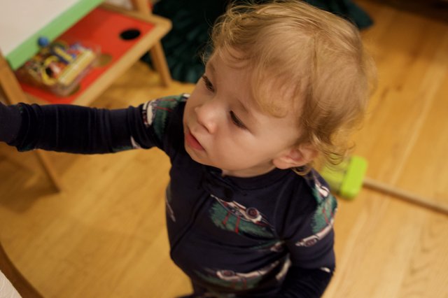 Toddler Pointing with Delight on Christmas Morning