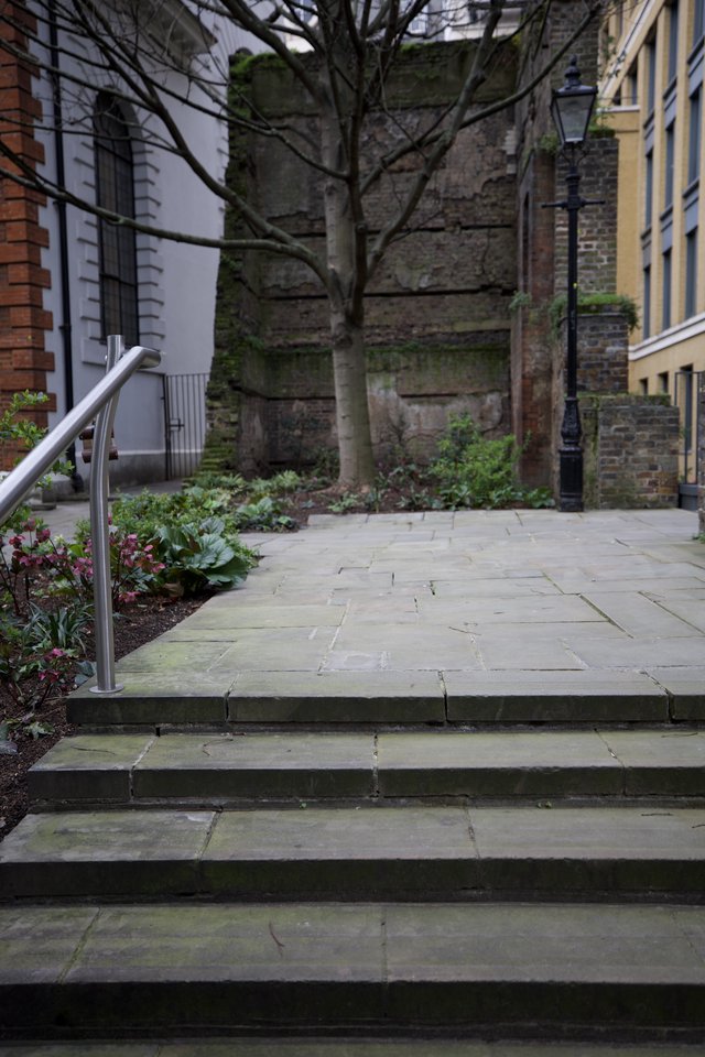 Weathered Stone Steps Leading to Historic Courtyard