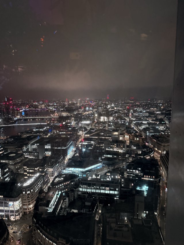 London Cityscape at Night with Fireworks Display