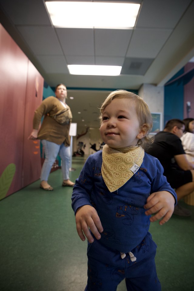 Joyful Toddler in Blue at Daycare Center