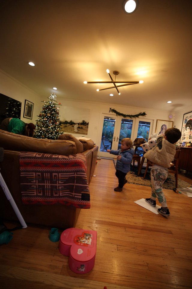 Children Playing in Cozy Living Room on Christmas Evening