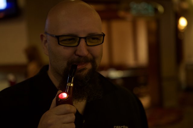 Bearded Gentleman Enjoying a Smoke and a Drink