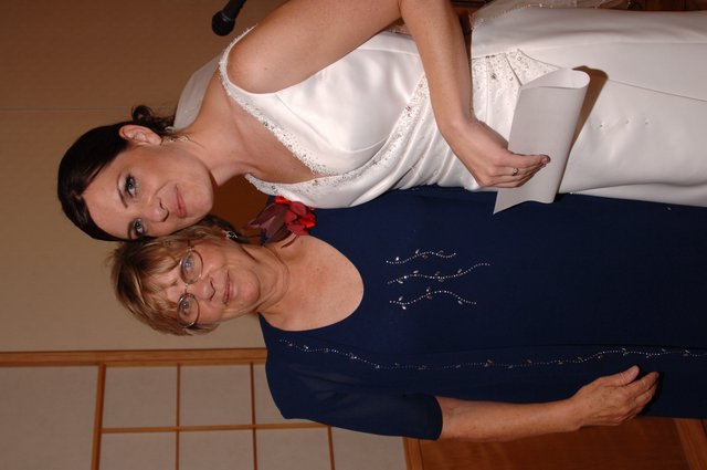 Bride and Loved One Share a Joyful Wedding Day Moment