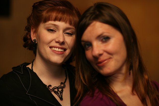 Two Smiling Women Share a Warm Moment Together