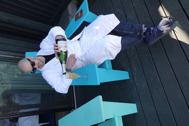 Relaxing with Champagne in White Robe