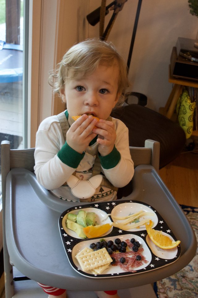 Toddler Enjoying a Healthy Snack at Home