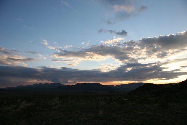 Desert Sunset with Majestic Mountains